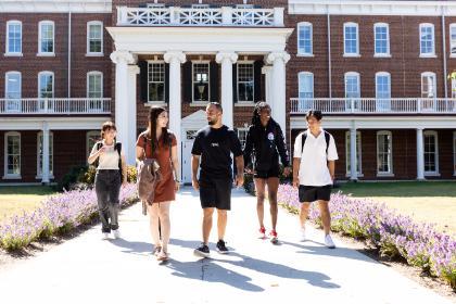 Students walk in front on Rotunda Hall