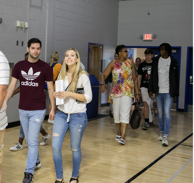 students walk into willett for orientation
