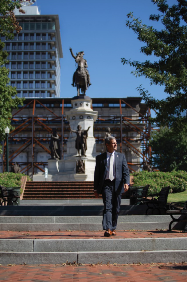 As director of Virginia’s Department of General Services, Joe Damico ’85 has wide-ranging responsibilities, including the construction of the new General Assembly Building, visible here in the background behind the Washington statue.