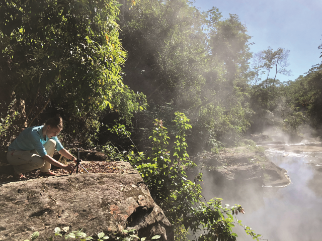 Becky Schnekser stages a 360- degree camera to collect images and videos of Shanay-Timpishka, a boiling hot thermal river in the Peruvian rainforest. (Photo courtesy of Wesley Della Volla)