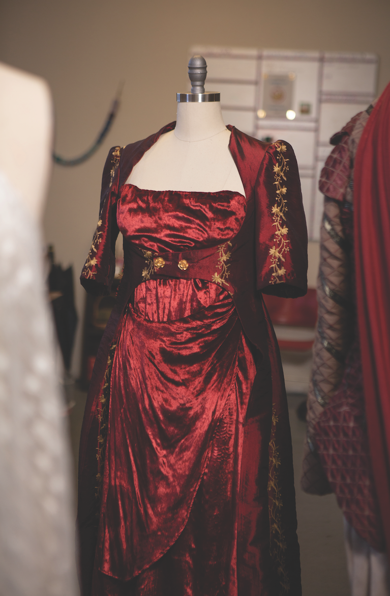Costume shop manager Hope Maddox ’15 designs costumes herself as well as helps bring the vision of guest designers to life. This velvet gown, one of hundreds of costumes in stock at the center, will be worn by the actor portraying Octavia in an upcoming production of Antony and Cleopatra.