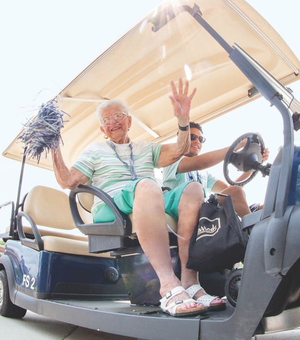 Alum Weekend - Woman in golf cart