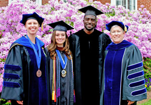 Award recipients Dr. Stephanie Buchert (from left) and Jamie Leigh Yurasits '13 were congratulated after commencement by the speaker, Ransford Doherty '97, and Interim President Marge Connelly