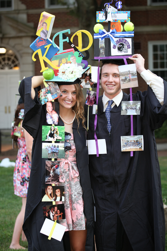 Kelly Farr (left) and Blaine Mills show off their mortarboards. During Convocation, seniors are presented outrageously decorated mortarboards by their little sisters/little brothers in a long-standing Longwood custom known as 