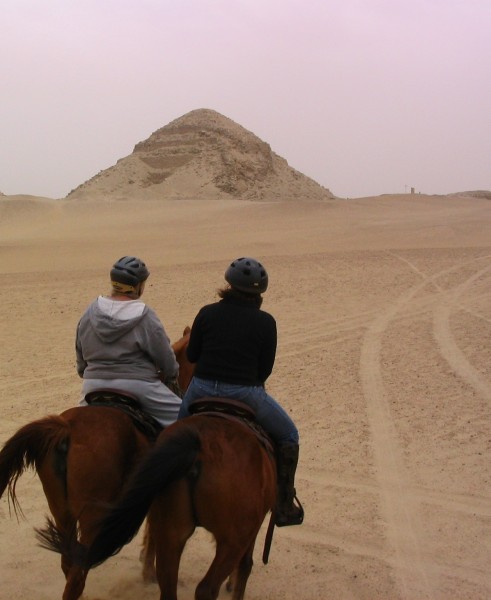Students ride toward an Egyptian pyramid