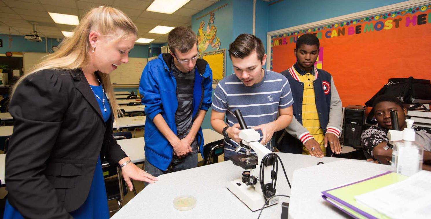 Dr. Amorette Barber, assistant professor of biology at Longwood, working with Prince Edward County High School students as they explore their local environment on a molecular level.