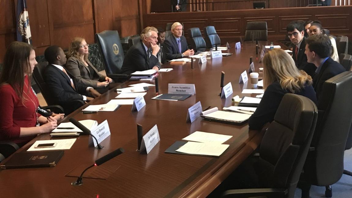 Longwood senior Praise Nyambiya sits with then-Gov. Terry McAuliffe as the Governor’s Millennial Civic Engagement Task Force delivers its recommendations in December.