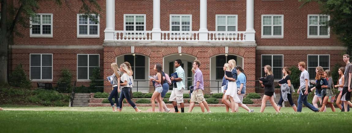 Students walking on campus during orientation